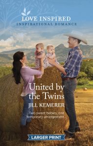 United by the Twins by Jill Kemerer. Wyoming mountains in the background, two rolled hay bales, a woman and cowboy hold identical twin baby girls near each other.