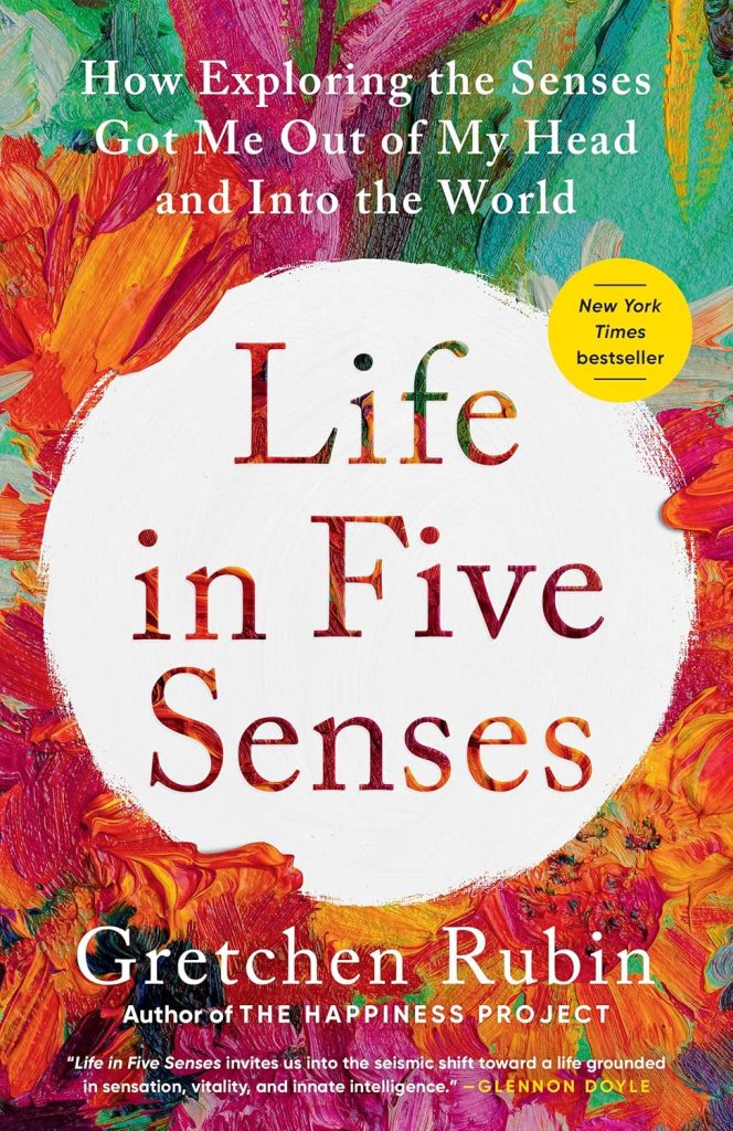 Book cover. Life in Five Senses by Gretchen Rubin. Swirls of mostly red and yellow with blue-green paint