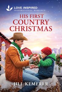 His First Country Christmas by Jill Kemerer cover. Cowboy sitting on snow-covered hay bale with little boy. White fence and red barn in the background with snow falling